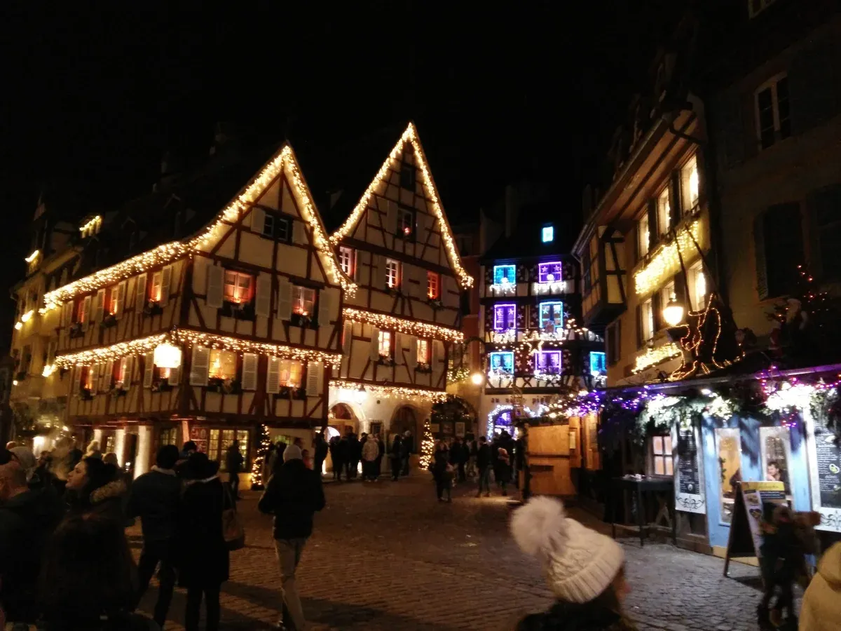 Colmar old town houses outlined in Christmas lights at night