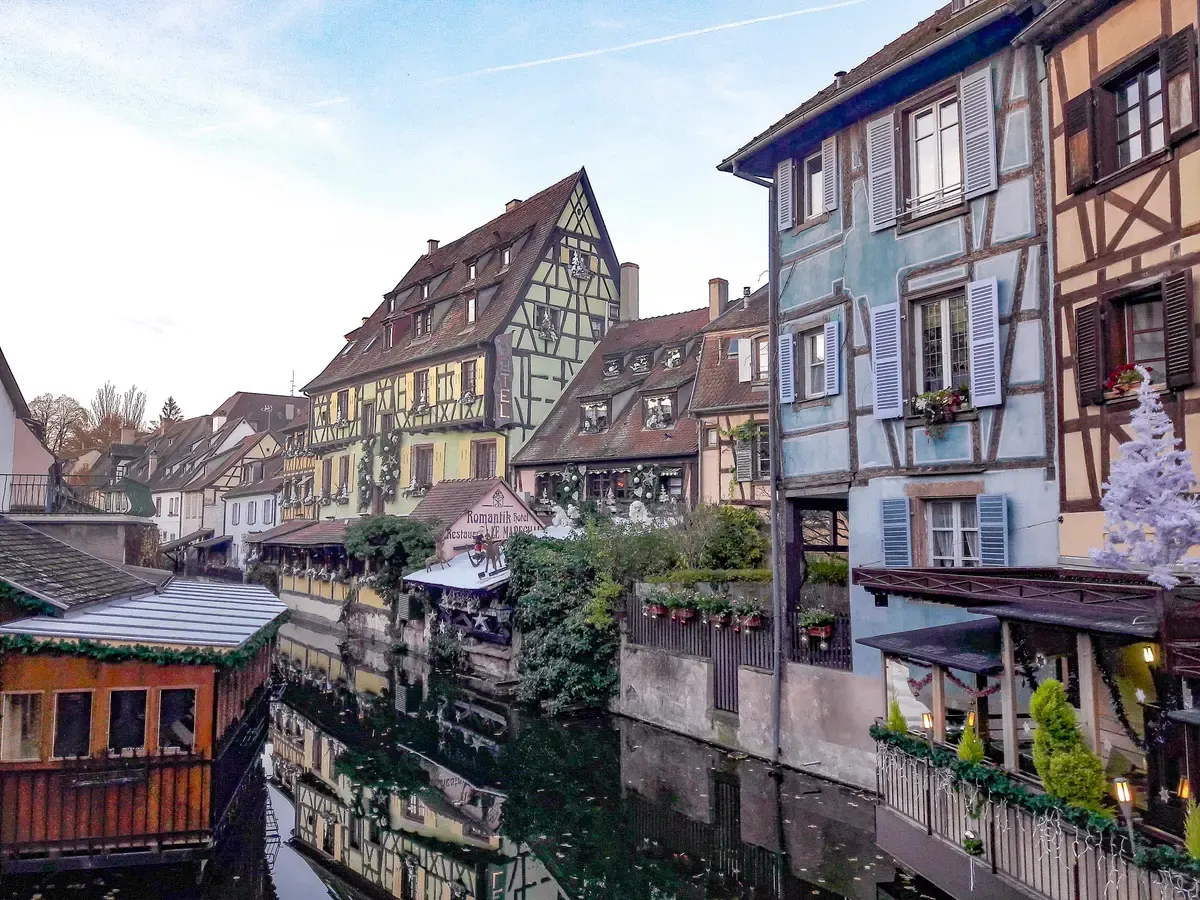 Half-timbered houses along the canal in Petite Venise, Colmar, with Christmas decorations