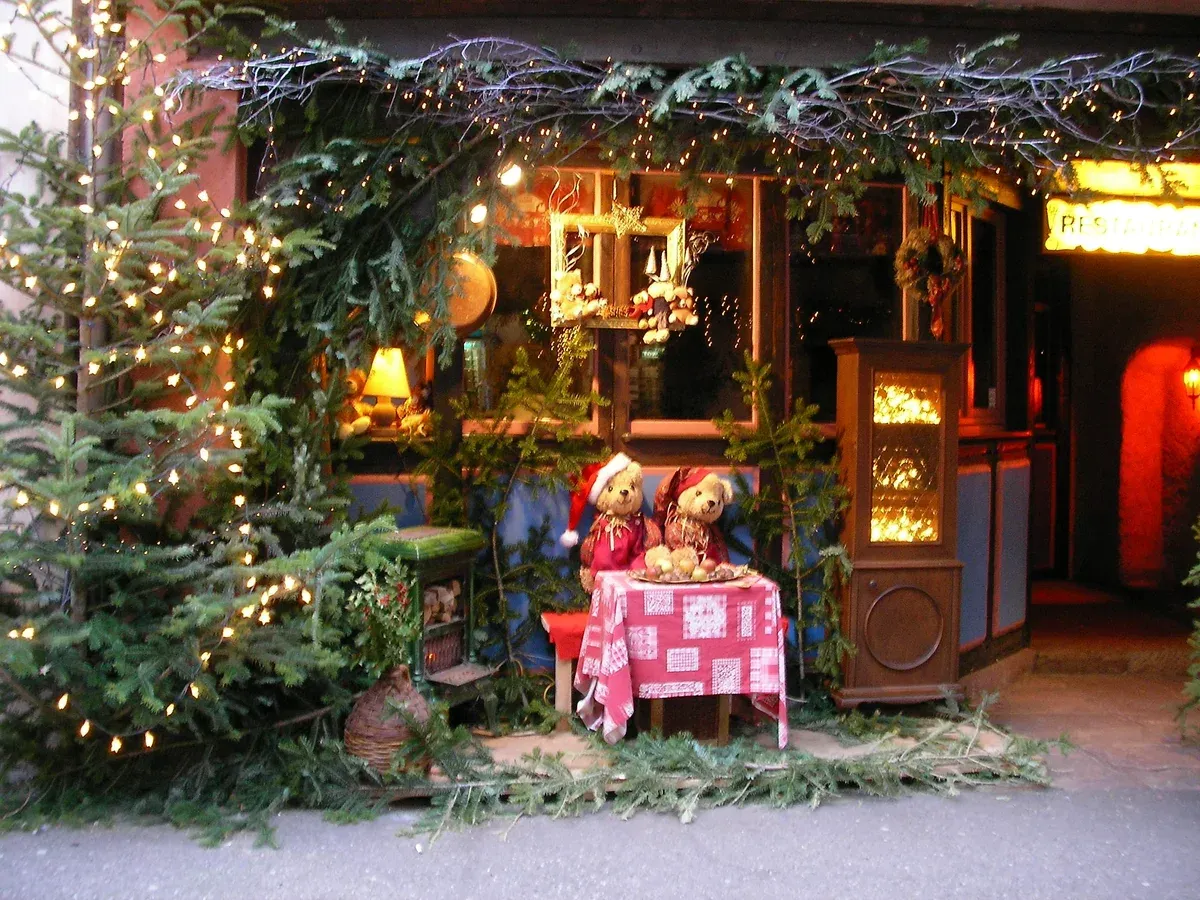 Decorated Christmas stall with teddy bears and fir garlands in Ribeauvillé